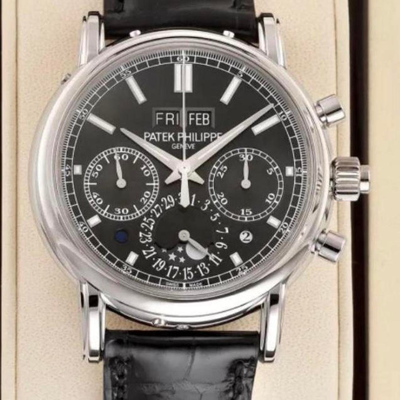 P0-431.jpg Patek Philippe Men's Black and Silver Watch - Image 1